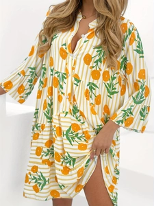 Women's V-neck tiered floral dress with yellow stripes and ruffled sleeves in studio