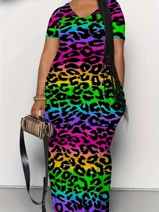Detail of neon leopard print texture and V-neckline on this plus size straight dress