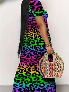 Detail of colorful rainbow leopard print on a sleeveless maxi dress with a woven straw bag