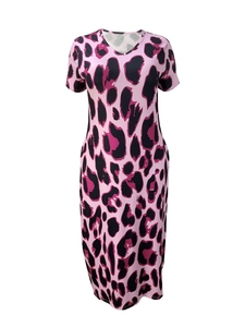 Detailed close-up of pink leopard print fabric on a stylish short-sleeve V-neck dress