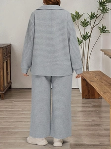 Detail of light blue waffle knit lounge set featuring wide-leg pants and loose fit