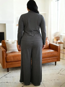 Rear view of elegant dark grey high-waisted wide-leg knit lounge set for women