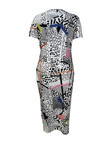 Detail of colorful geometric abstract print on short-sleeve V-neck midi dress