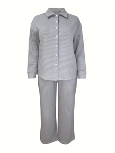 Detail of light gray quilted pajamas set featuring waffle texture and button-up front