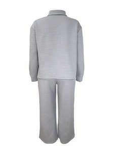 Detail showing waffle textured fabric on the back of the blue two-piece loungewear set