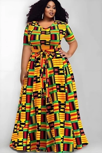 Detail of plus size maxi dress featuring vibrant Kente print and waist tie design