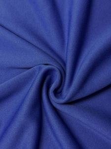 Close-up of soft navy blue knitted fabric with premium texture and flexible drape