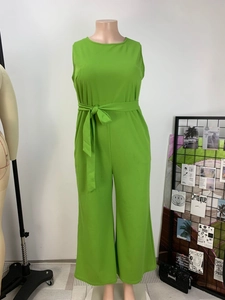Detailed view of green sleeveless wide-leg jumpsuit featuring a round neck and waist belt