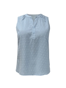 Close-up of light blue Swiss dot fabric with V-neckline and buttons on sleeveless top