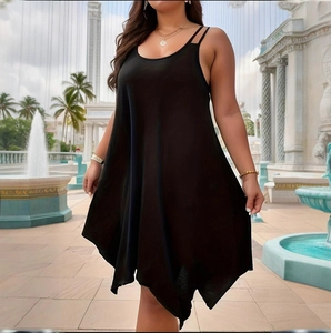 Detail view of the irregular handkerchief hem and lightweight fabric on this black dress