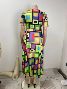 Detail view of women's printed maxi dress featuring vibrant geometric block patterns