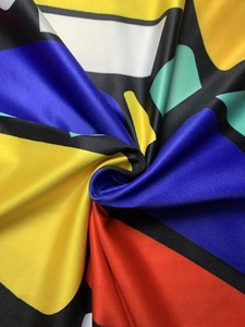 Detailed macro shot of the colorful geometric abstract print on soft polyester fabric