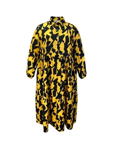Elegant long sleeve dress with yellow and black geometric print and layered skirt