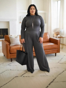 Elegant dark grey slim-fit lounge set featuring a high-neck top and wide-leg trousers