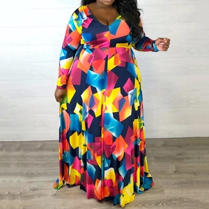 Detail of colorful geometric print and deep V-neckline on plus size maxi dress