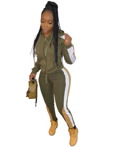 Detail of army green tracksuit featuring side color-block stripes and drawstring hood