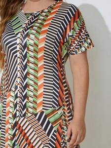 Detail of colorful geometric striped pattern on this short sleeve irregular dress