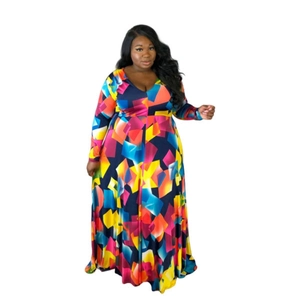 Detail of plus-size maxi dress showing colorful geometric print and deep V-neckline texture