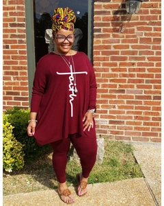 Detail of burgundy two-piece loungewear set with faith cross print on loose long-sleeve top