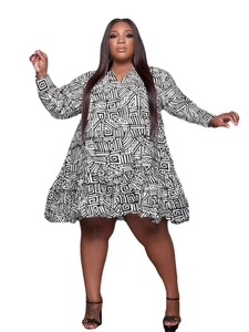 Close-up of V-neckline and geometric print on a plus size loose-fit A-line dress