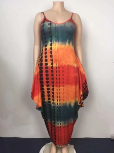 Detail view of tie-dye printed maxi dress showing vibrant orange and blue gradient pattern