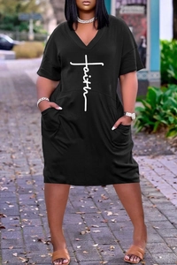Detail of V-neck black T-shirt dress featuring a white Faith cross print and side pockets