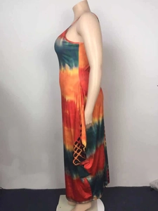 Detail view of colorful tie-dye maxi dress with unique geometric grid pattern on side pocket