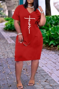 Close-up of red V-neck summer dress with Faith cross print and practical side pockets