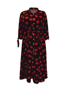 Detailed view of polka dot shirt dress with classic lapel and button-down front