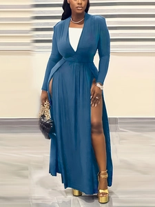 Detail of elegant navy V-neck dress featuring a high side slit and long sleeves