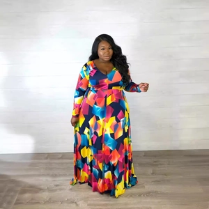 Plus size V-neck maxi dress featuring vibrant geometric prints and elegant long sleeves