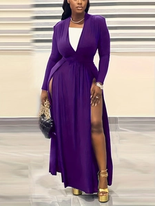Detail of a deep purple long sleeve maxi dress with deep V-neck and high side slits