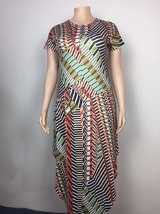 Detail of plus size long dress with vibrant geometric stripe pattern and crew neck