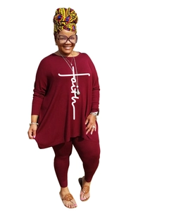 Detail view of burgundy faith letter and cross print on oversized long sleeve top