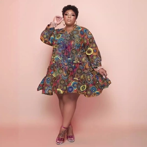 Afro-centric plus size V-neck dress with colorful abstract print and ruffled hemline