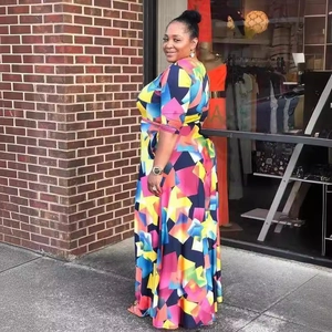 Vibrant geometric print plus size maxi dress with long sleeves and cinched waistline