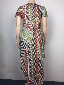 Detail of multi-color geometric print dress showing back view and irregular hemline