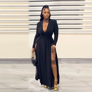 Detail of elegant black long sleeve maxi dress with deep V-neck and high side slits