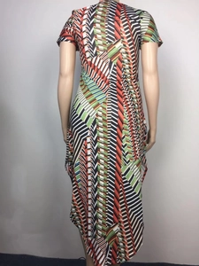 Detail view of colorful geometric abstract print on asymmetrical short sleeve dress