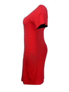 Detail view of red short sleeve dress featuring a round neck and side pockets