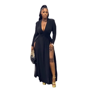 Detail of elegant black deep V-neck maxi dress with long sleeves and high side slit
