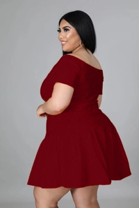 Side view of two-piece dark red plus size set with off-shoulder top and pleated skirt