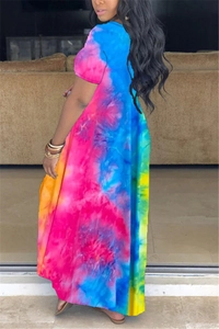 Macro detail of vibrant blue and orange tie-dye print on casual short sleeve maxi dress