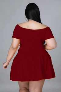 Detail view of deep red off-shoulder pleated dress back with waist slimming cut
