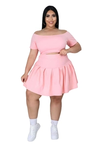 Detail view of pink plus size two-piece set featuring off-shoulder top and pleated skirt
