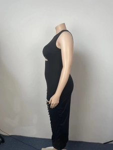Detail view of black bodycon dress featuring sexy side cut-out and fringe hole patterns