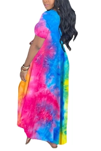 Detail of colorful tie-dye long dress with vibrant blue, pink and yellow abstract patterns