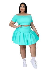 Detail of mint green crop top and high-waisted pleated tennis skirt set for women