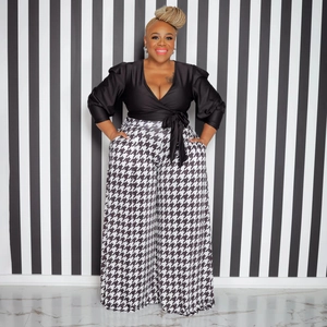 Women's plus size two-piece set with black wrap top and houndstooth wide leg pants