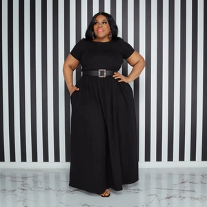 Detail of plus size black maxi dress with a decorative rhinestone buckle waist belt